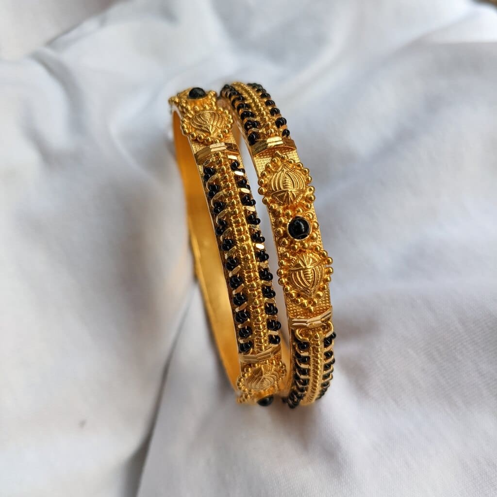 Buy Yellow Gold & Black Bracelets & Bangles for Girls by Malabar Gold &  Diamonds Online | Ajio.com